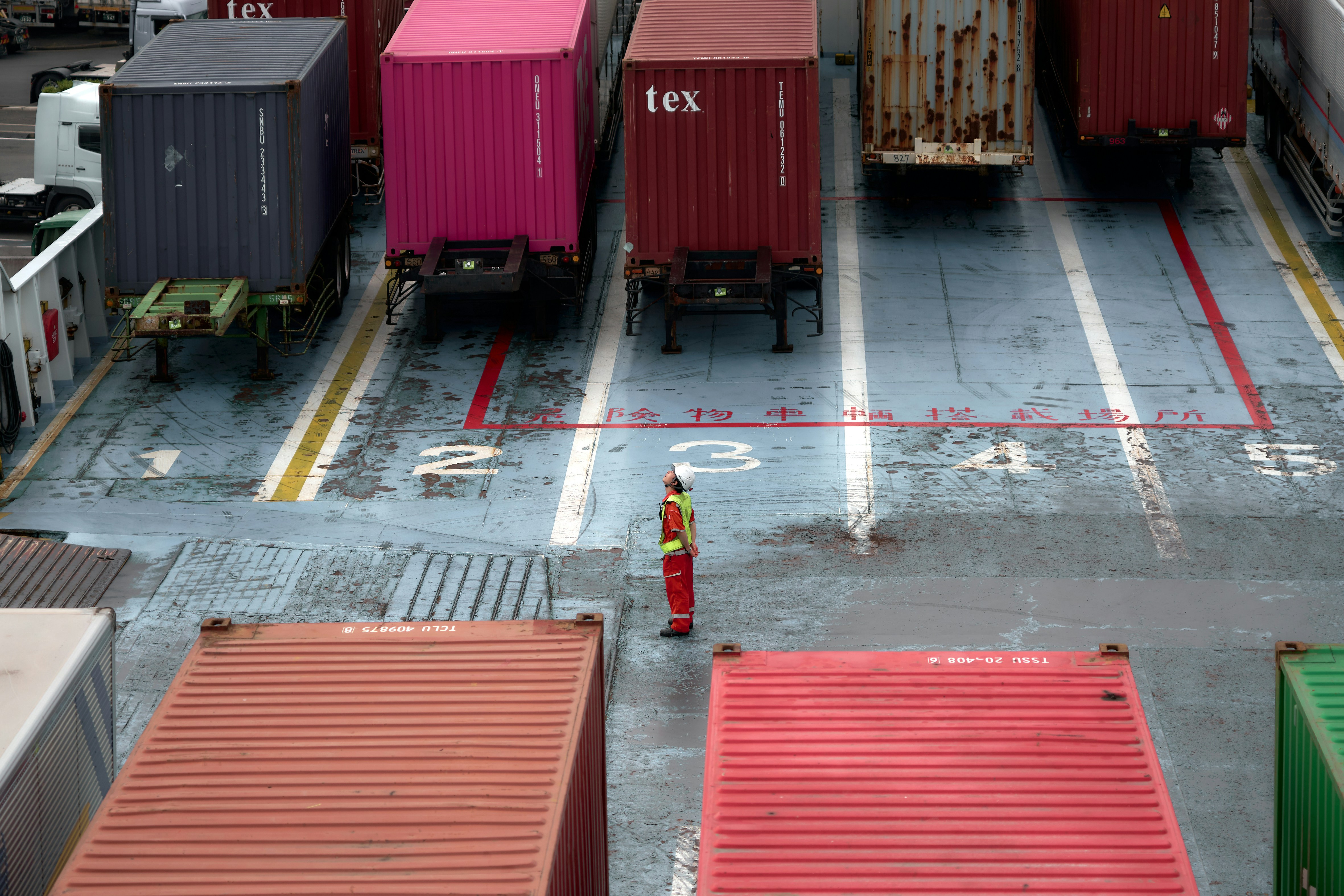 A cargo truck is parked in a parking lot